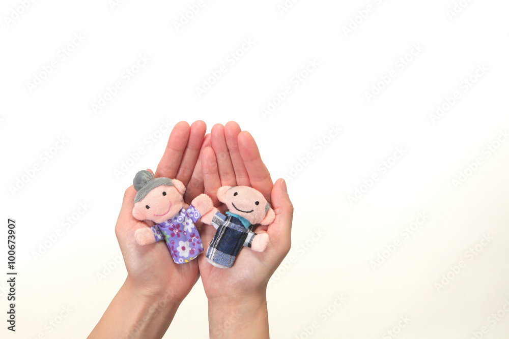 Fototapeta premium Puppet of the old couple in the hand
