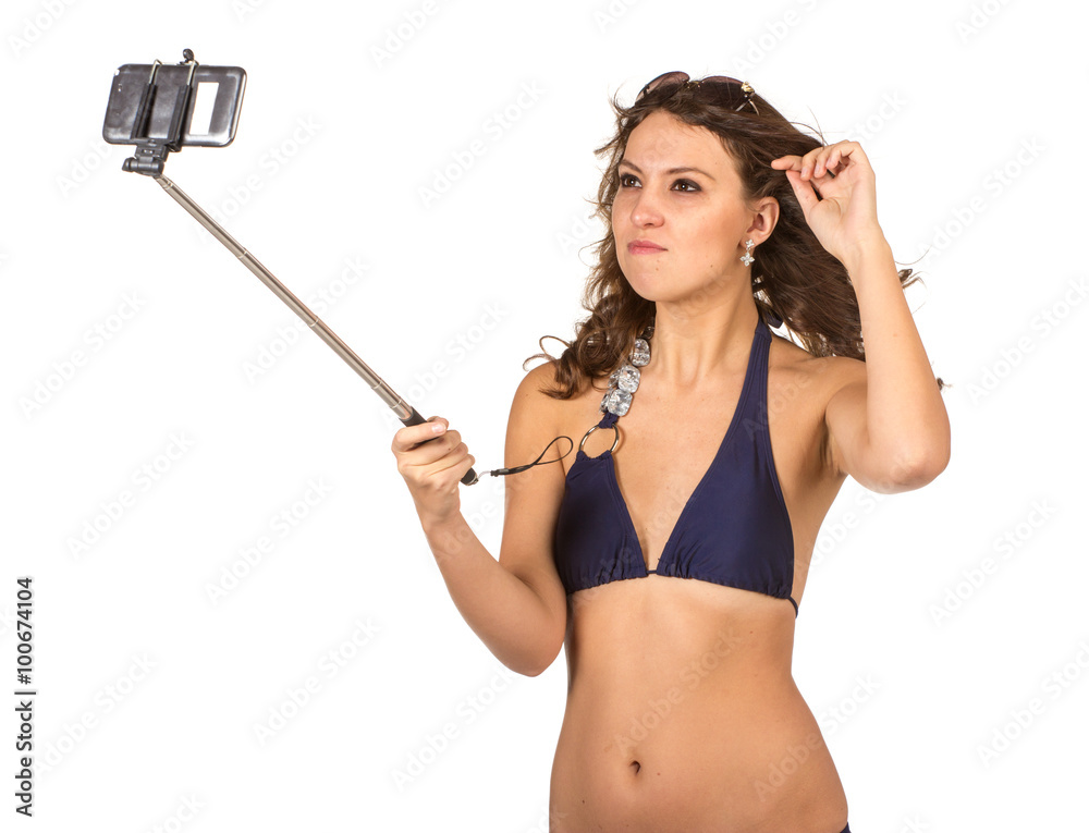 Woman in swimsuits taking a selfie. Woman in swimsuits taking a selfie.
