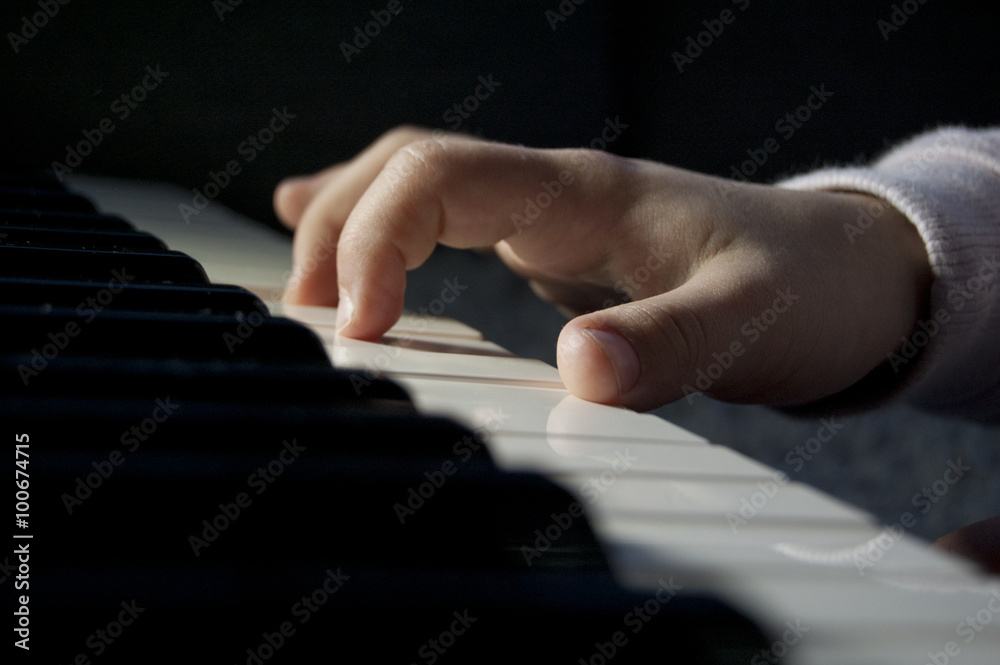 Fototapeta premium kids hands play piano