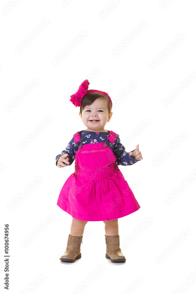 A portrait of a toddler learning to walk isolated on white