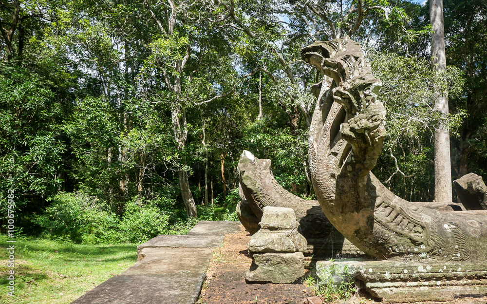 Big seven headed cambodian snake statue (Naga) in temple ruins. Angkor Wat, Siem Reap, Cambodia
