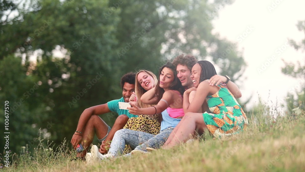Group of friends having a great time taking selfies Group of friends having a great time taking selfies
