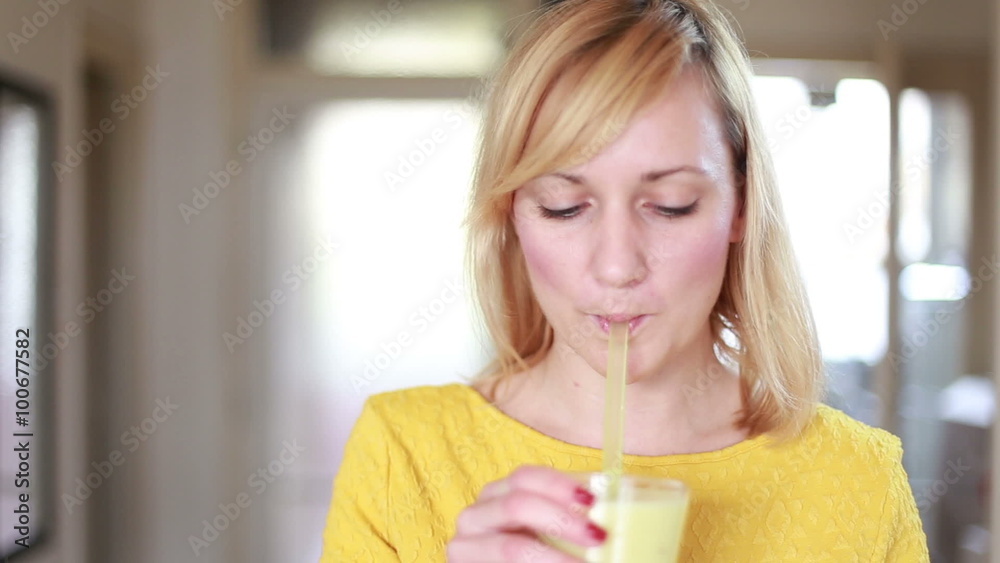 Happy girl drinking fruit smoothie Happy girl drinking fruit smoothie
