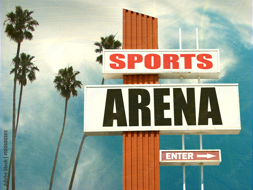 aged and worn vintage photo of sports arena sign with palm trees