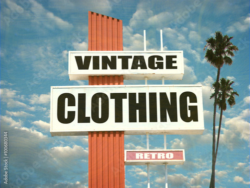 aged and worn vintage clothing sign with palm trees