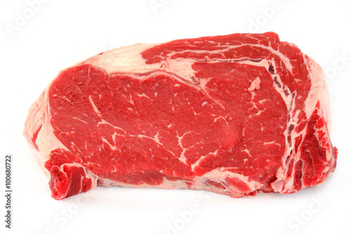 fresh raw rib eye steak on white background