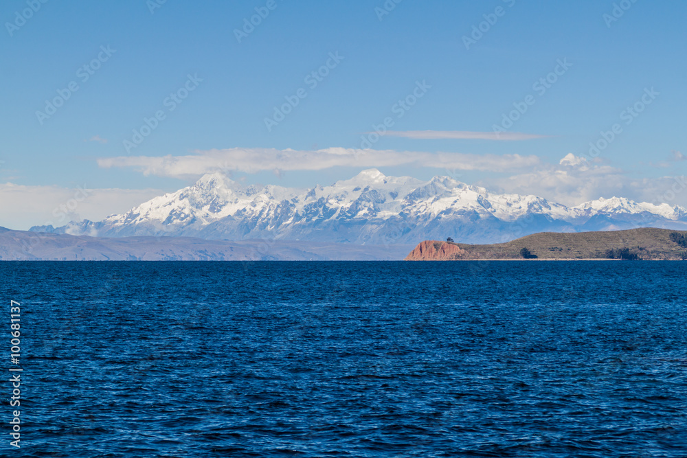 Cordillera Real mountain range behind Titicaca lake, Bolivia. Isla de la Luna also visible.