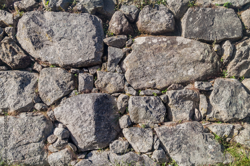 Detail of a stone wall of an agricultural terrace at Machu Picchu ruins, Peru