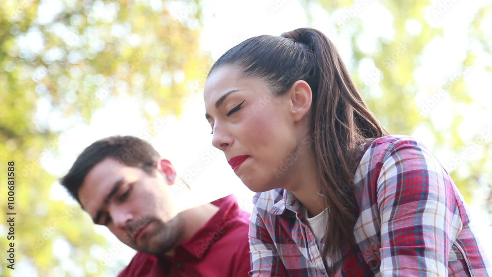 Close-up of young woman singing and man playing guitar Close-up of young woman singing and man playing guitar