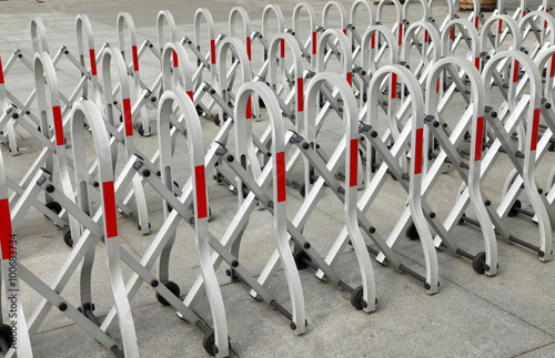 Sliding and folding barrier with wheels