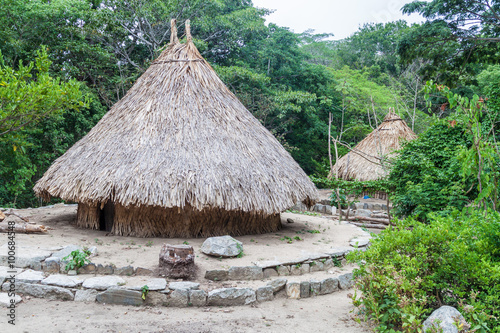 Traditional rustic houses of indigenous Kogi people in Tayrona National Park, Colombia photo