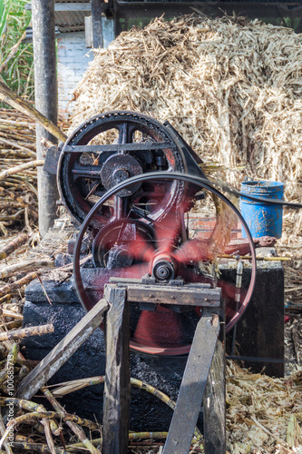 Small sugar cane mill producing panela (unrefined whole cane sugar), in Obando near San Agustin, Colombia photo