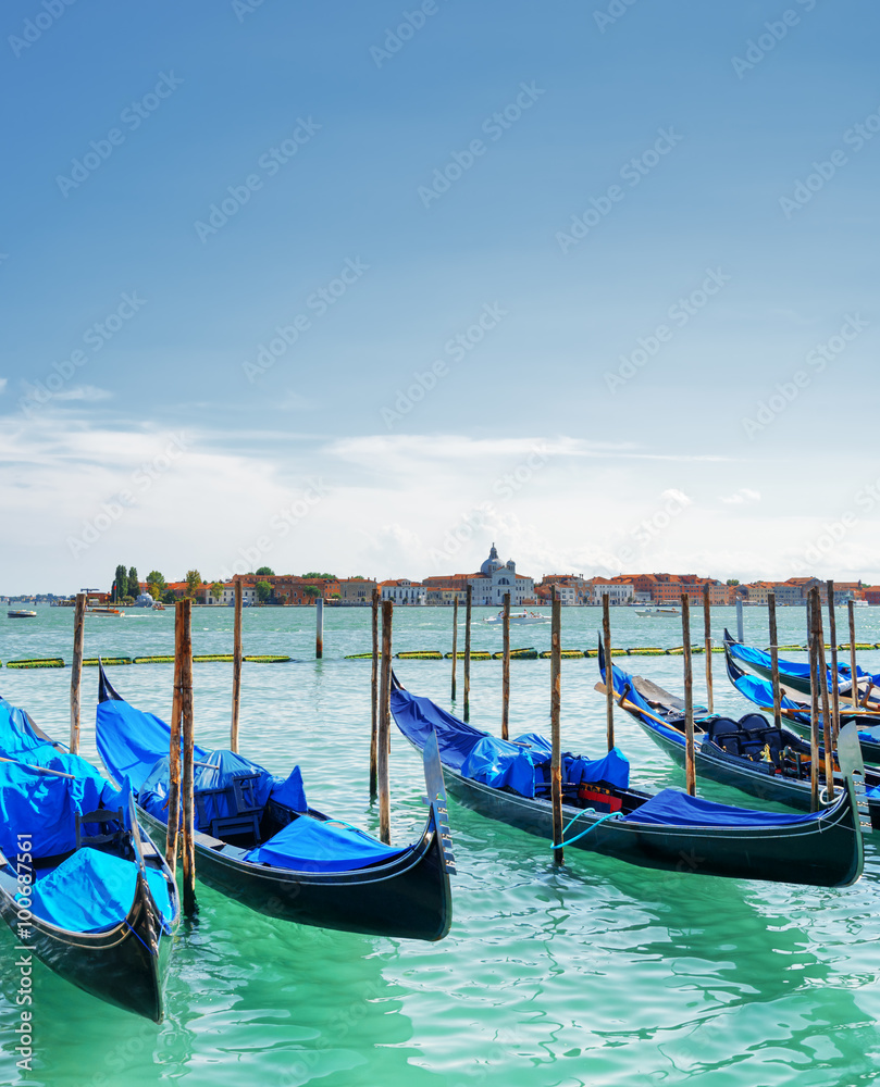 Gondolas parked on the Venetian Lagoon in Venice, Italy