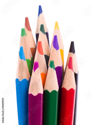 Many different colored pencils on white 