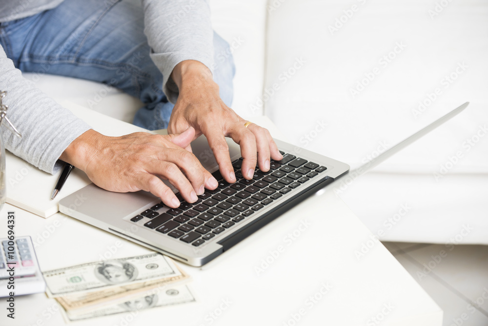 Man doing finance with tablet computer and mobile phone Man doing finance with tablet computer and mobile phone