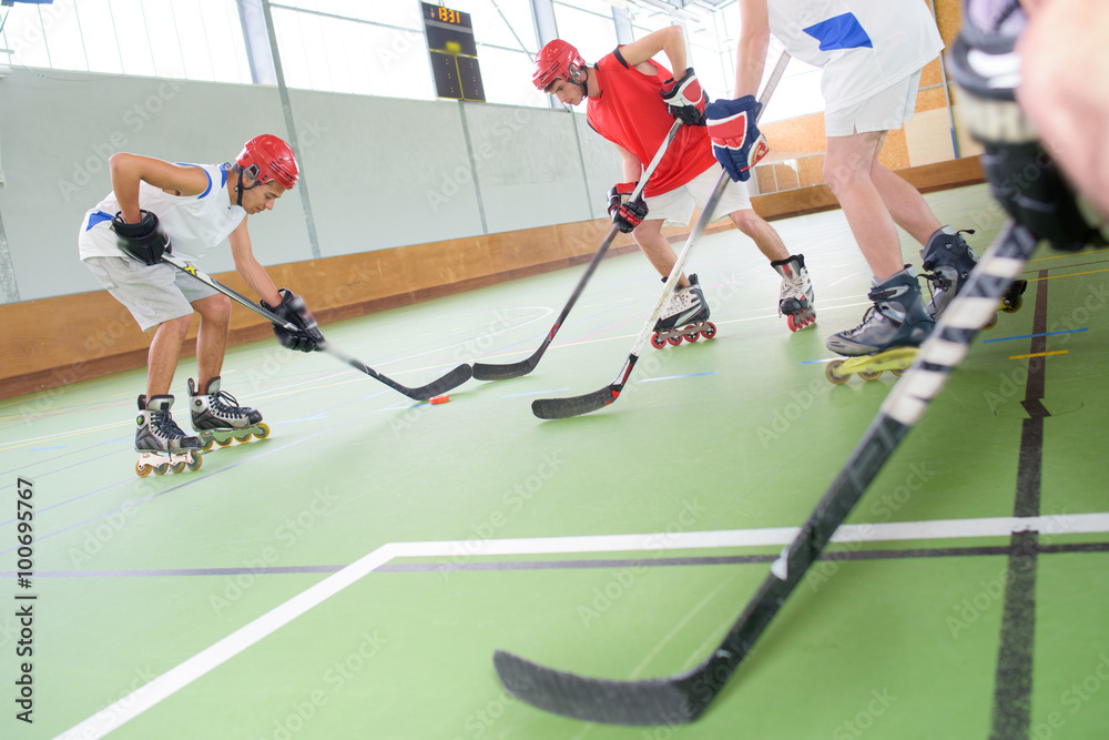 Fototapeta premium Men playing roller hockey