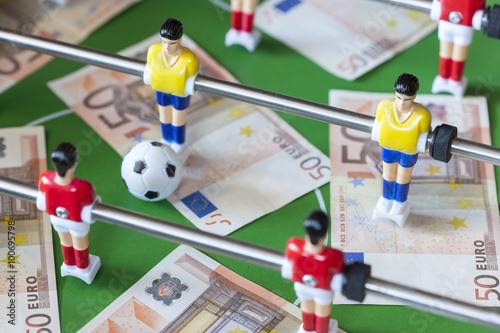 Sports and money. Concept about money spending in football (soccer), sports betting and manipulated fixed matches