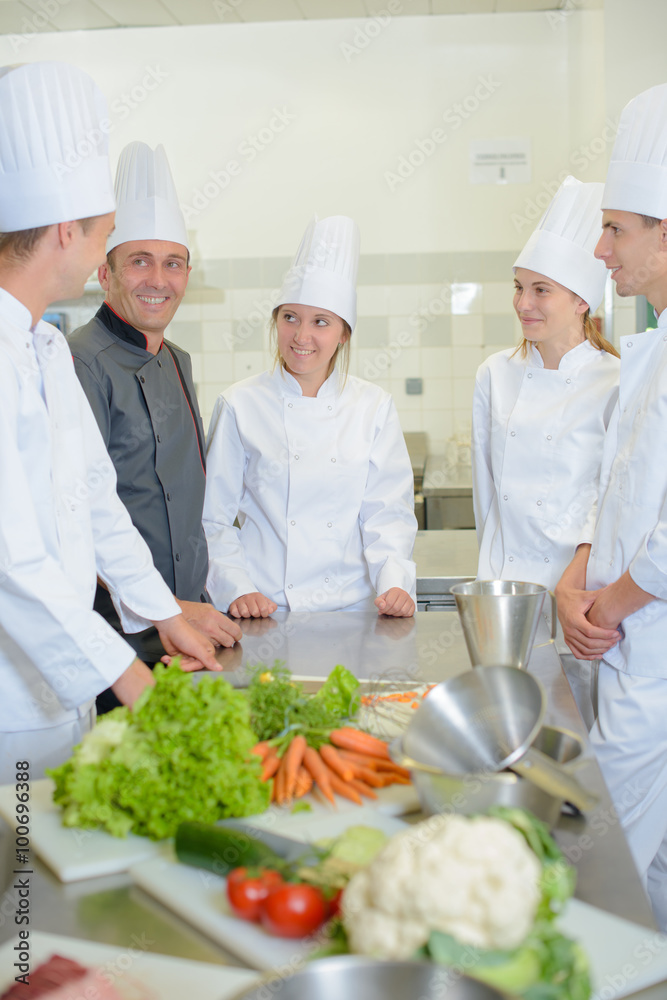 Trainees in kitchen with chef