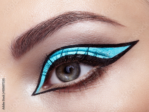 Beautiful woman face. Perfect makeup. Beauty fashion. Eyelashes. Cosmetic Eyeshadow. Make-up detail. Eyeliner