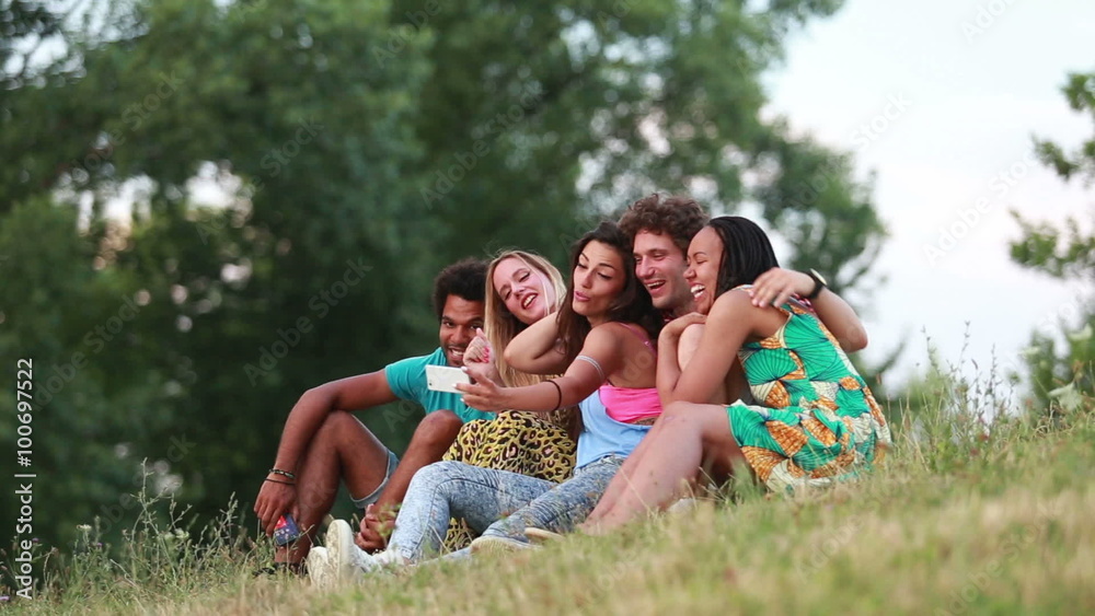 Group of friends having a great time taking selfies Group of friends having a great time taking selfies