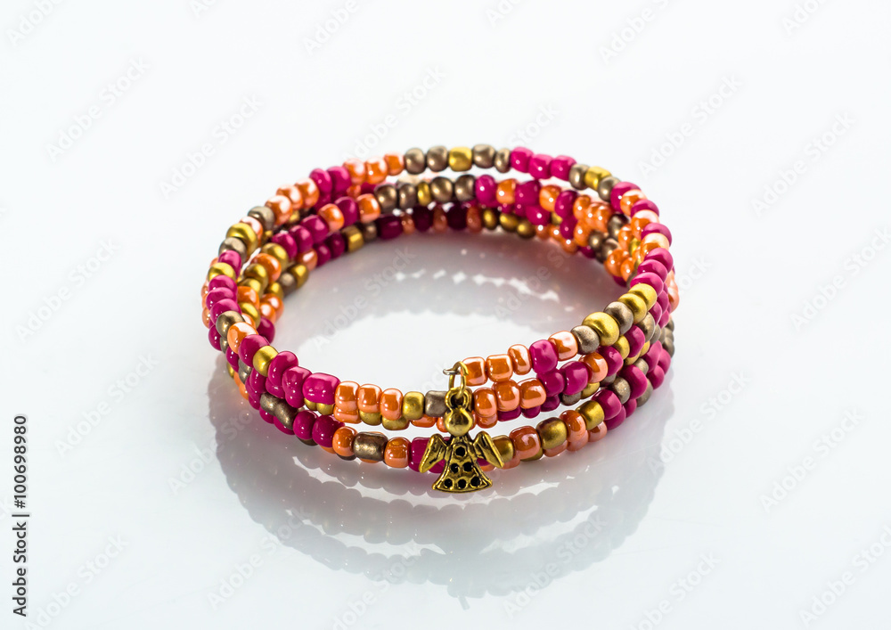 Beautiful bracelet with colorful beads isolated on white background Beautiful bracelet with colorful beads isolated on white background