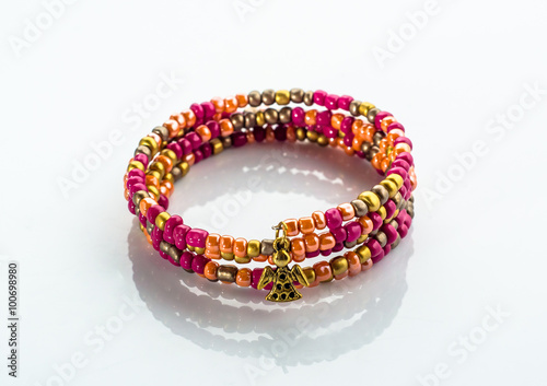 Beautiful bracelet with colorful beads isolated on white background