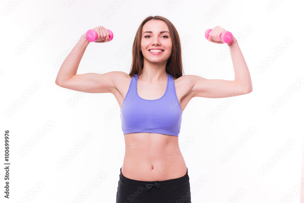 Active sportive athletic woman with dumbbells pumping up muscles biceps concept fitness sport training lifestyle Active sportive athletic woman with dumbbells pumping up muscles biceps concept fitness sport training lifestyle