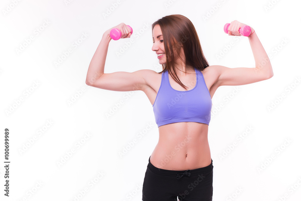 Active sportive athletic woman with dumbbells pumping up muscles biceps concept fitness sport training lifestyle Active sportive athletic woman with dumbbells pumping up muscles biceps concept fitness sport training lifestyle