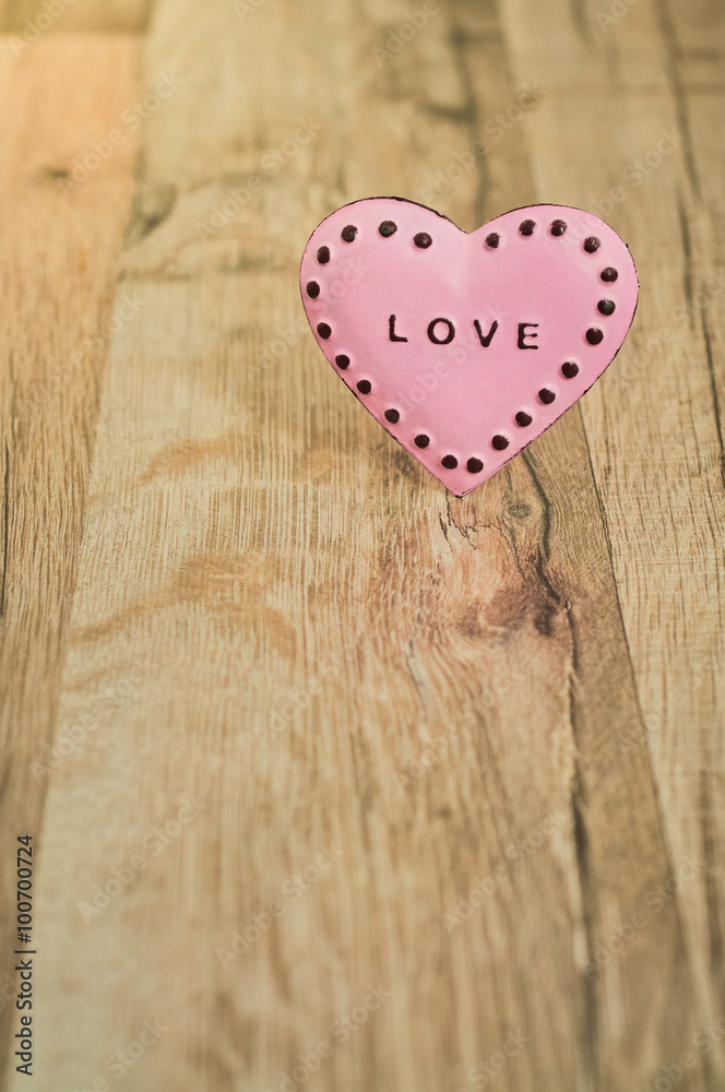 Valentines Day heart with inscription/Pink heart with place for text on the wooden background Valentines Day heart with inscription/Pink heart with place for text on the wooden background