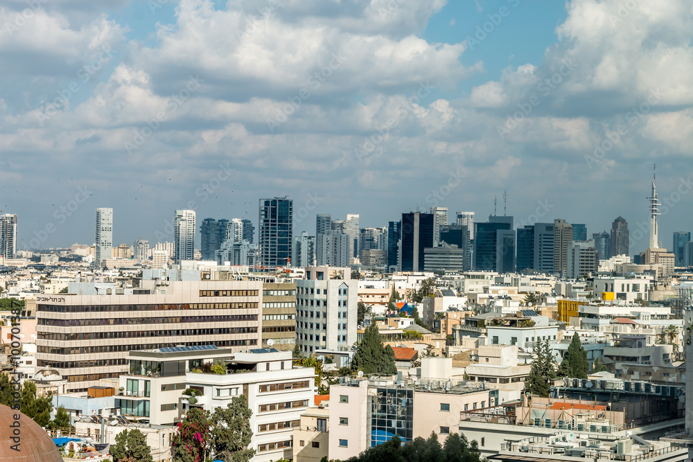 view of a modern city, city of Tel Aviv, in winter with clouds