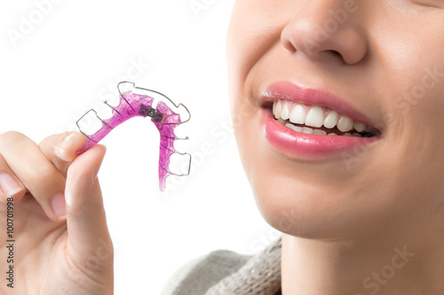 Woman with orthodontic removable brace photo