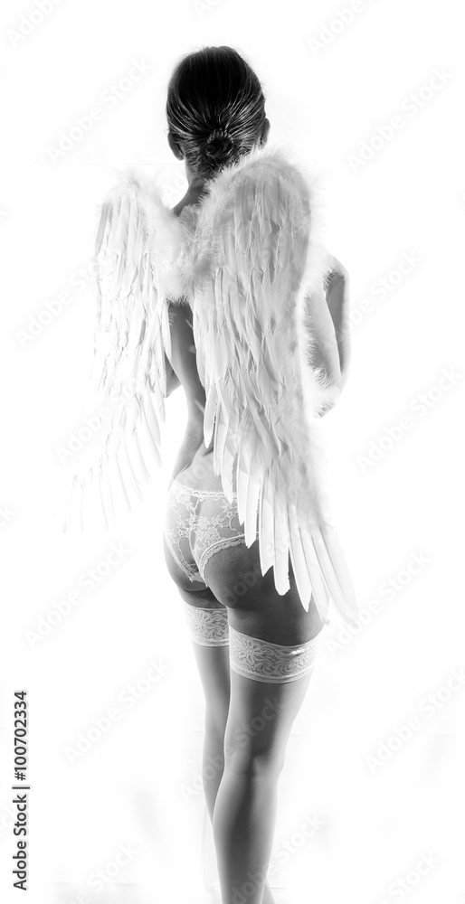Naklejka premium Sexy beautiful woman with wings posing in elegant lingerie 