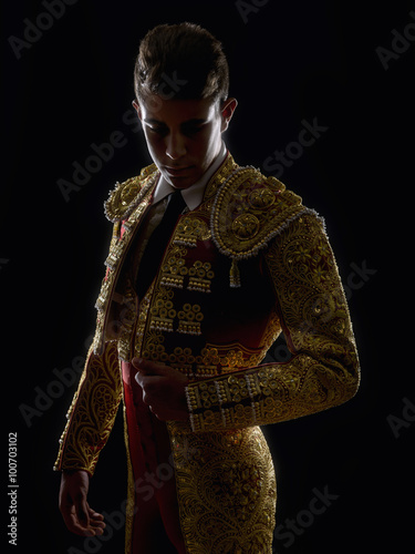 Young bullfighter, dressed in traditional costume to fight
