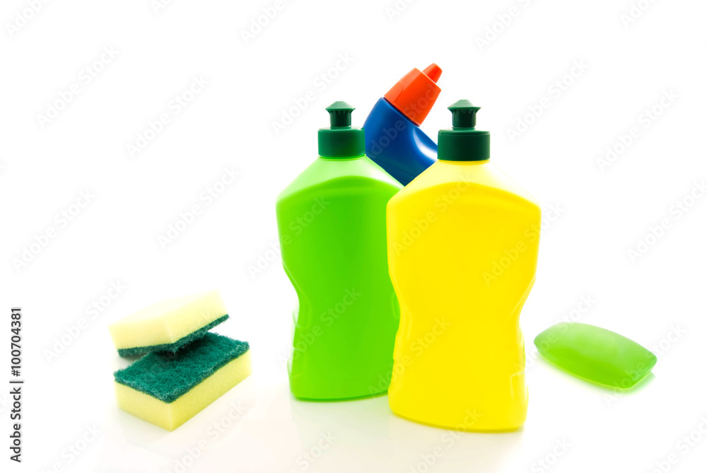 three bottles of detergent, soap and sponges three bottles of detergent, soap and sponges