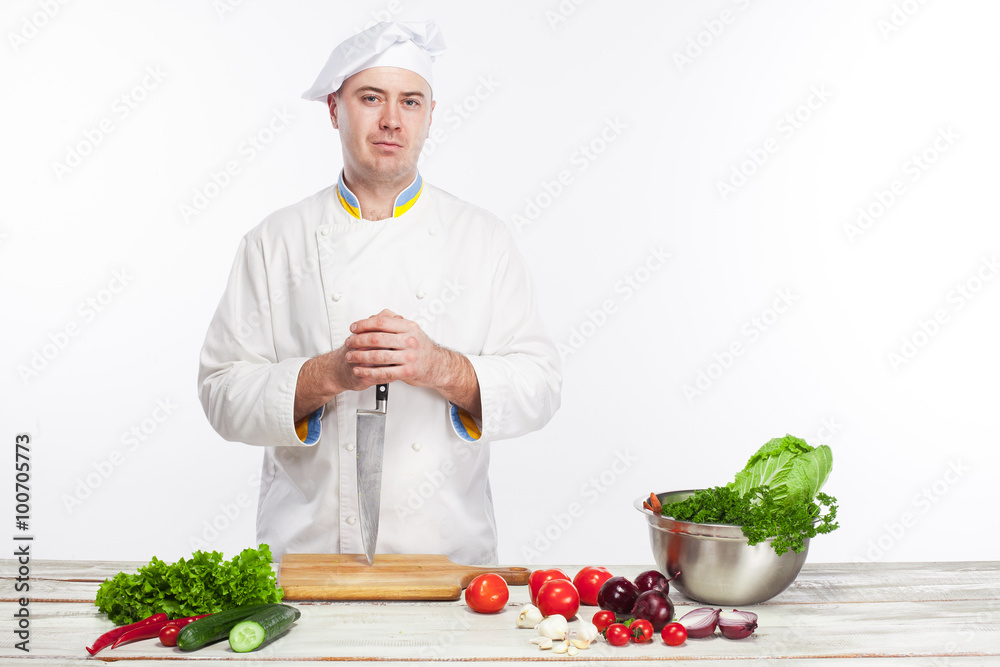 Chef posing with knife in his kitchen Chef posing with knife in his kitchen
