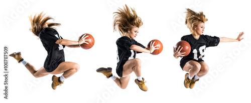 Woman jumping and playing basketball