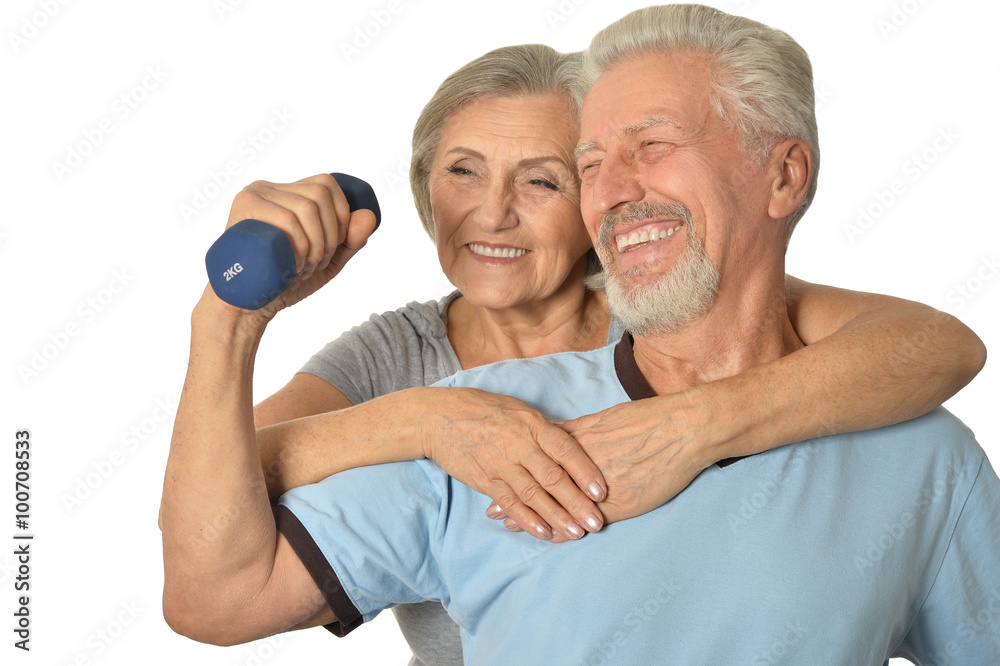 Senior Couple Standing With Dumbbells Senior Couple Standing With Dumbbells