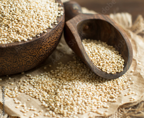 White Quinoa with a wooden spoon and bowl