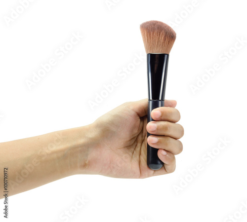 hand holding makeup brush
