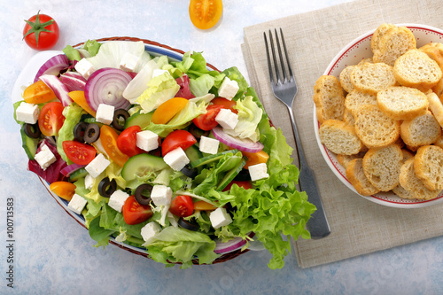 Greek salad with feta cheese black olives and bruscheta photo