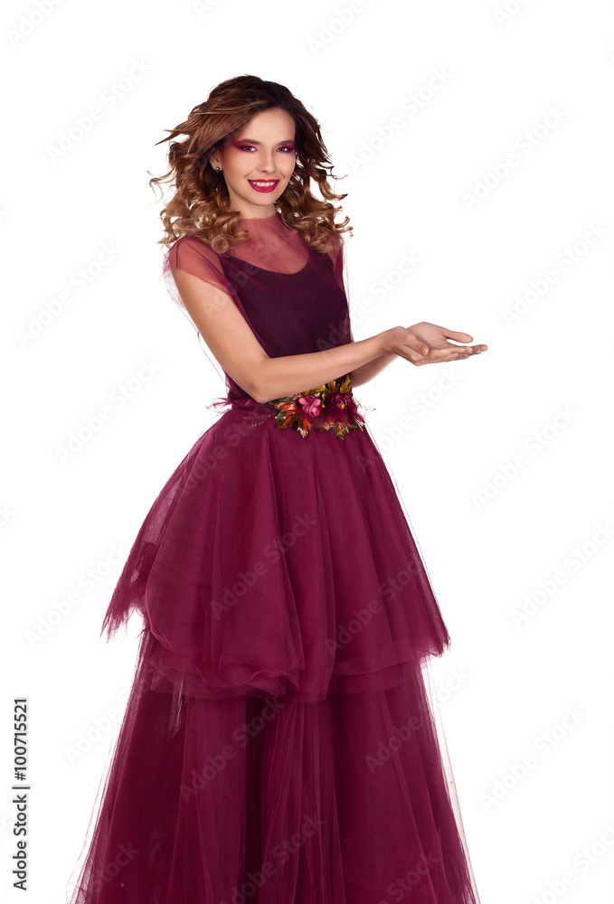Young beautiful woman model in fairy red marsala dress showing empty copy space for product on the open hand palm, Isolated on white background. Young beautiful woman model in fairy red marsala dress showing empty copy space for product on the open hand palm, Isolated on white background.