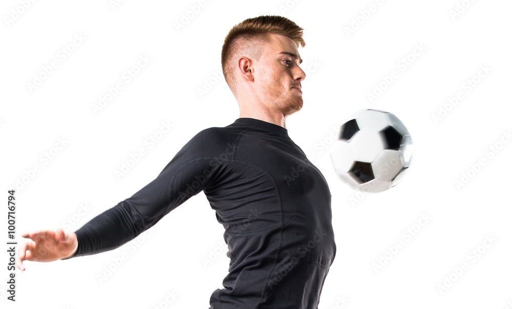 Young blonde man playing football Young blonde man playing football