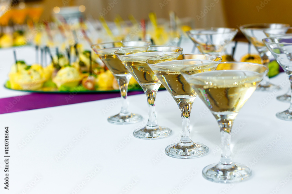 Four glasses of champagne on the banquet table Four glasses of champagne on the banquet table