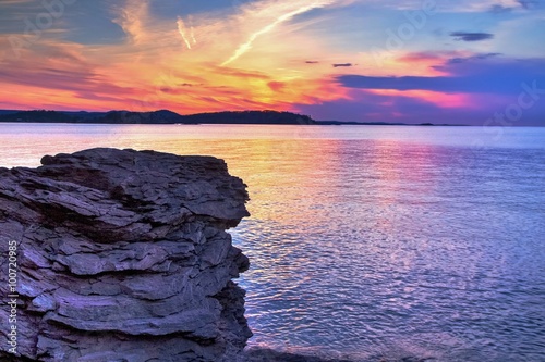 Magical Marquette Michigan Sunset. Sunset along the shores of Presque Isle Park in Marquette, Michigan. This beautiful park is located in the heart of Marquette. The Upper Peninsula's largest city. photo