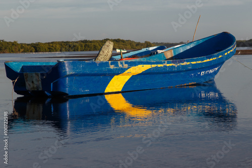 wood boat on water from Las penitas, Nicaragua photo
