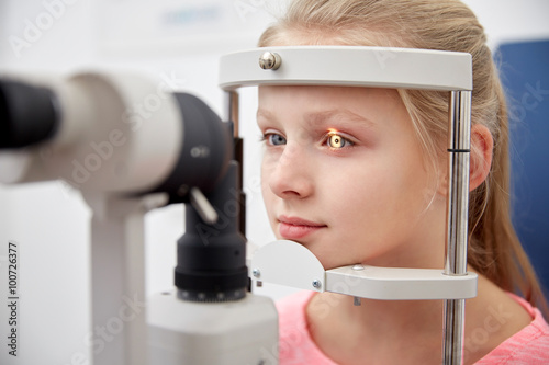 Fototapeta Naklejka Na Ścianę i Meble -  girl checking vision with tonometer at eye clinic