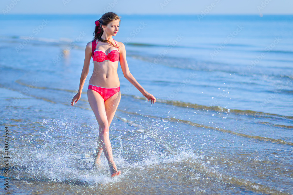 Fototapeta premium Beautiful young woman bikini pinup at beach