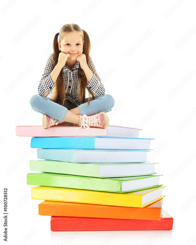 Cute little girl sitting on stack of books isolated on white Cute little girl sitting on stack of books isolated on white