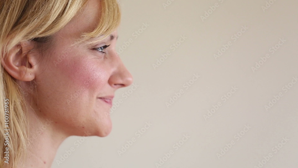Profile of a woman drinking smoothie with a straw Profile of a woman drinking smoothie with a straw