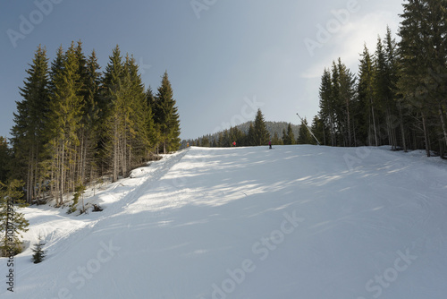 winter ski track with skiers © tbaeff